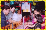 Mr. Suman distributing free game tokens to the guests, click here to see large picture.